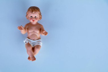 Small statue of Infant Jesus on white background, Christmas concept, space for text