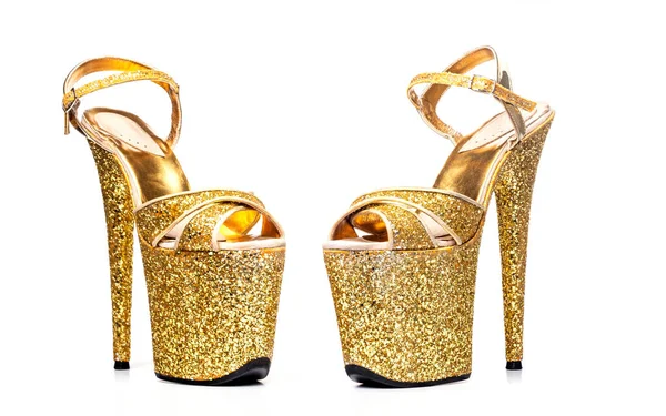 Gold striptease shoes. High-heeled shoes. Strips of three for poleldance, exotic, strip of plastic. strips for the store catalog