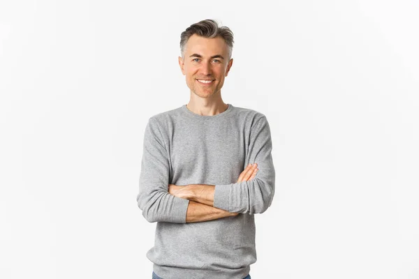 stock image Image of successful and confident middle-aged man, cross arms on chest and smiling satisfied, standing determined over white background