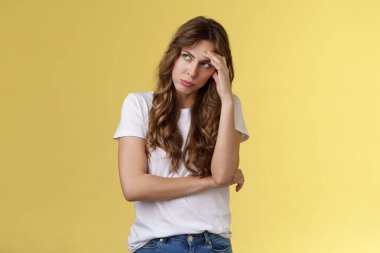 Gosh what nuisance. Embarrassed annoyed young ignorant displeased woman exhale air breathing out gasping irritated look away hiding face feel humiliated pissed attend uninteresting event