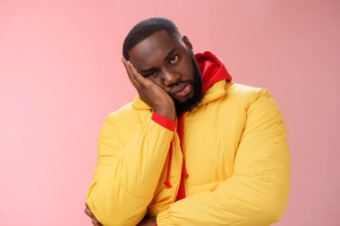 Annoyed bothered pissed african-american bearded man in yellow jacket facepalm look angry camera irritated lean head hand bored fed up pissed hearing uninteresting same stories, pink background
