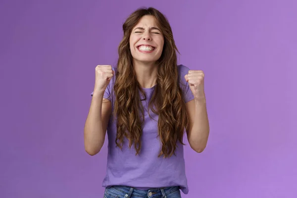 Yes I did it. Relieved happy triumphing joyful girl pump fists celebrating excellent achievement raise head up close eyes thank god winning first prize stand purple background happy — Stock Photo, Image