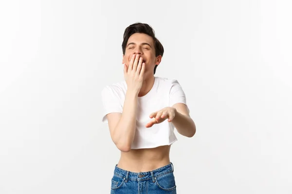 Lgbtq and pride concept. Image of silly gay man in crop top laughing and pointing hand at camera, chuckle over funny joke, white background — Stock Photo, Image