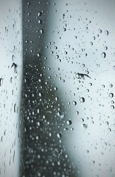 Blurred raindrop to the window — Stock Photo, Image