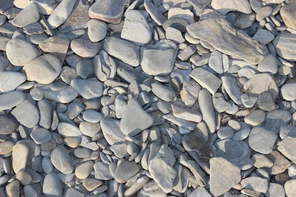 Mar rochas lisas na costa — Fotografia de Stock