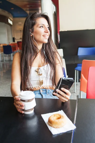 Young girl with a warm drink — Stock Photo, Image