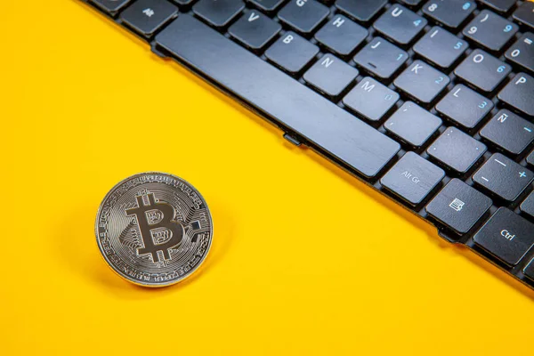 Photograph Bitcoin Coins Symbolizing Financial Market Cryptocurrencies Colored Background Keyboard — Stock Photo, Image