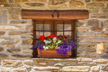Wooden window and flowers on the windowsill clipart