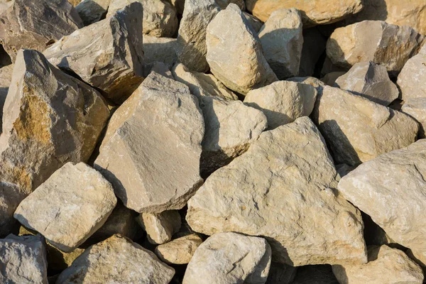 large natural stones piled up in the bright sun