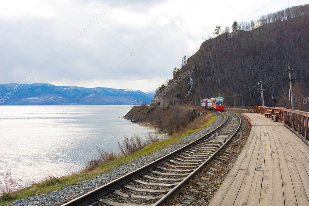Circum Baikal railway and train. Circum-Baikal railway and train arriving at Slyudyanka station.