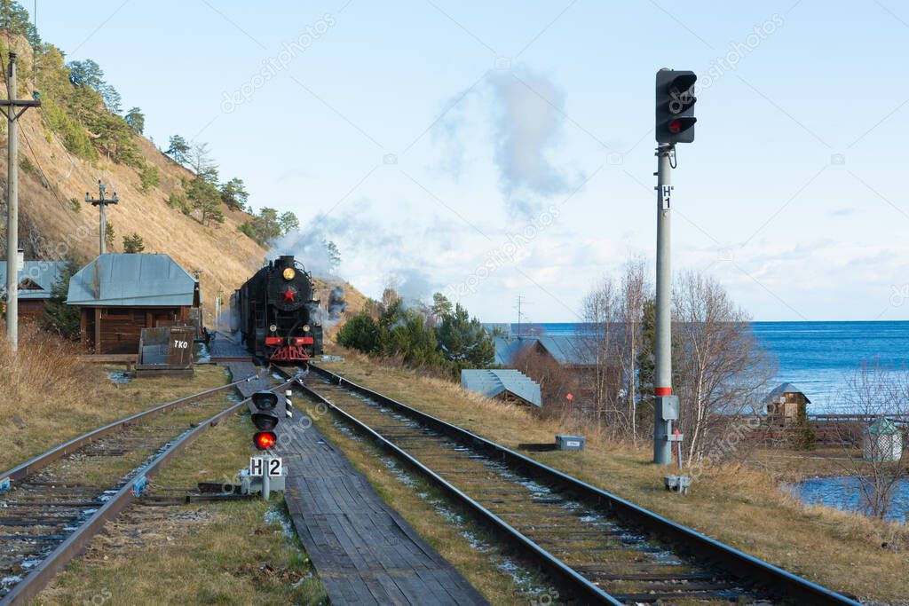 Circum Baikal railway and train. Circum-Baikal Railway and a steam locomotive arriving at the station.