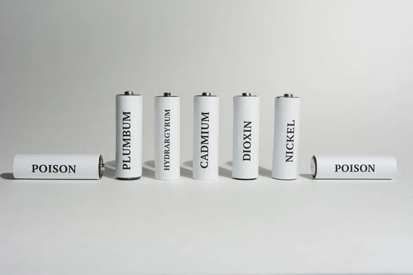 Battery on a white background. Battery for charging. Ecology. Harm to nature from batteries.