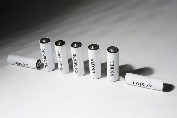Battery on a white background. Battery for charging. Ecology. Harm to nature from batteries.