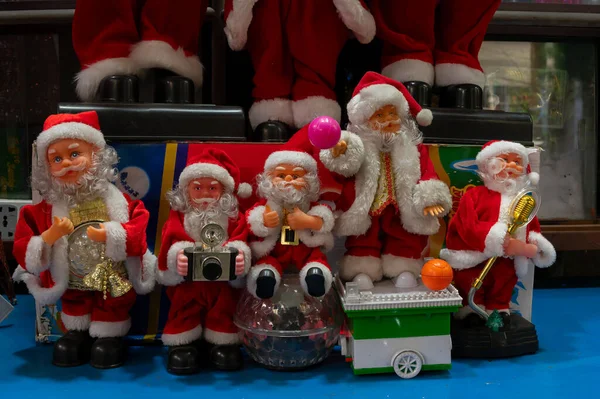 Happy Joyful Santa Claus Dolls Various Musical Instruments Displayed Sale — Stock Photo, Image