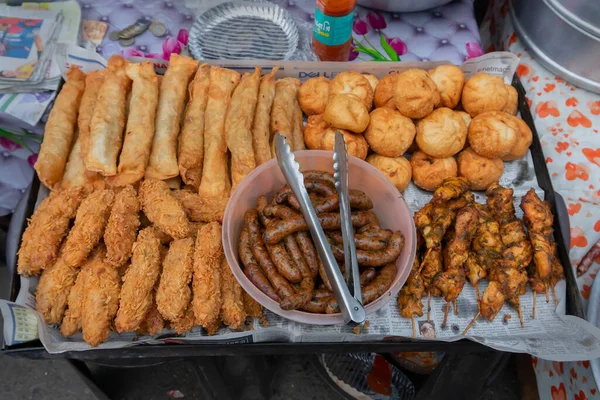 Kolkata, West Bengal, India - 16th December 2018 : Fried pork, chicken, sausage, fish snacks are being sold at Territy Bazar, Kolkata. These are popular items for a chinese breakfast.