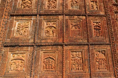Famous terracotta (fired clay of a brownish-red colour, used as ornamental building material) motif artworks at Madanmohan Temple, Bishnupur, West Bengal, India. UNESCO heritage site of India. clipart