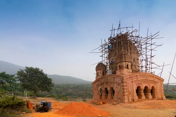 Gar Panchkot, Purulia , West Bengal, India - 23rd December, 2015 : Labours renovating Garhpanchkot Garh with bamboo framework, Gar or garh (fort) of the king of Kashipur, who built this old temple.