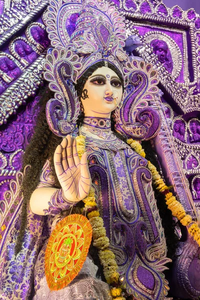Blessing hand , Idol of Goddess Saraswati at Kolkata, West Bengal, India. Saraswati is Hindu goddess of knowledge, music, art, wisdom, and learning. Worshipping is done in spring in India.
