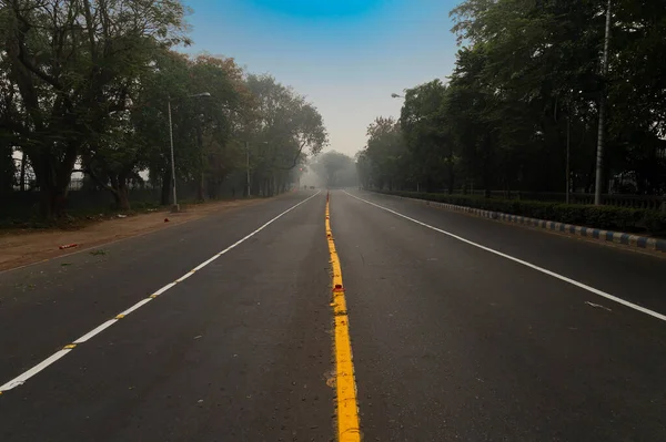 A deserted city road of kolkata city under lockdown due to corona virus. Kolkata is the capital city of West Bengal, India which came under lockdown to avoid getting people affected by corona virus.