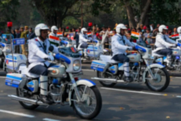 Blurred image of West Bengal Police are marching past on their motorcycles, bike rally for India\'s republic day celebration. With safe drive save life message. Kolkata, West Bengal, India.