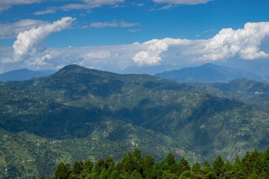 View of Himalayan mountain, blue sky and forest from Tarey Bhir point, tourist spot, Sikkim, India. 'Bhir' means cliff in the local language,about 10,000 feet long path, breathtaking view at the edge.