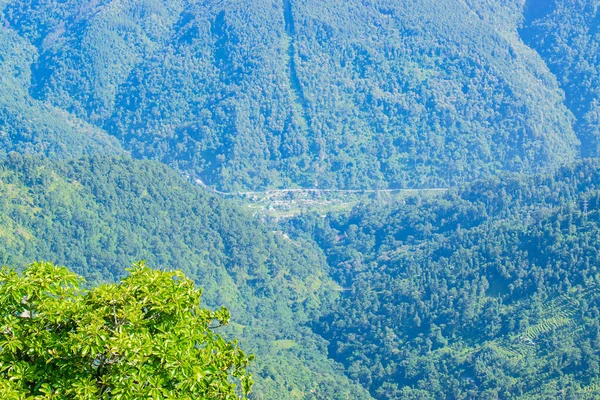 Sikkim Road down below from view of Tarey Bhir point, popular tourist spot, Sikkim,India. The word 'Bhir' means cliff in the local Nepal language, a breathtaking view at the edge, Himalayan mountains.