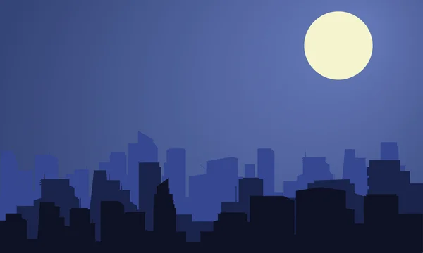 Silhouet van de stad met de maan in de nacht — Stockvector