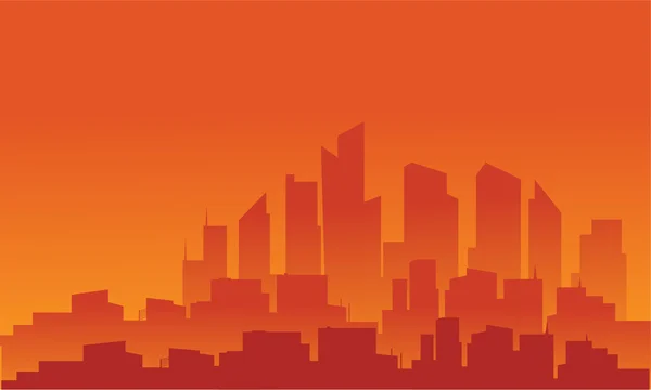 Silueta de edificio con fondo naranja — Vector de stock