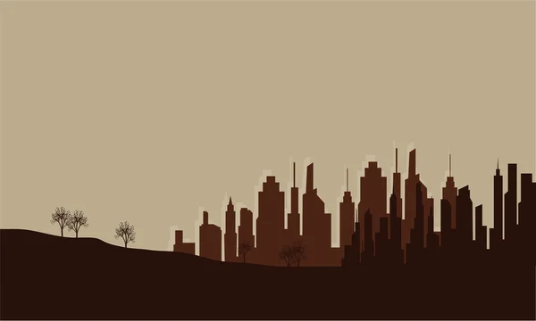 Silhouette de la ville sur le terrain — Image vectorielle