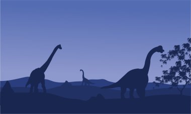 Brachiosaurus mavi arka plan ile silüeti