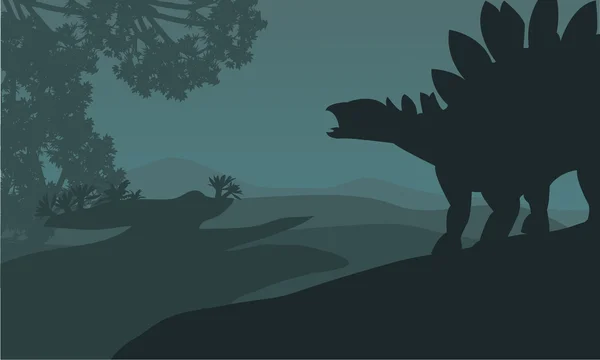 Enda stegosaurus silhuett i hills — Stock vektor