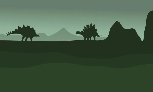 Stegosaurus in Feldern Landschaft Silhouette — Stockvektor