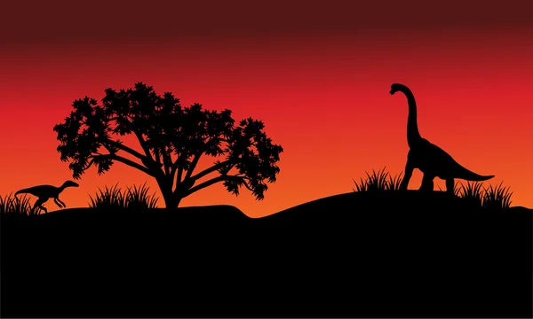 Pada pagi hari eoraptor siluet dan brachiosaurus - Stok Vektor