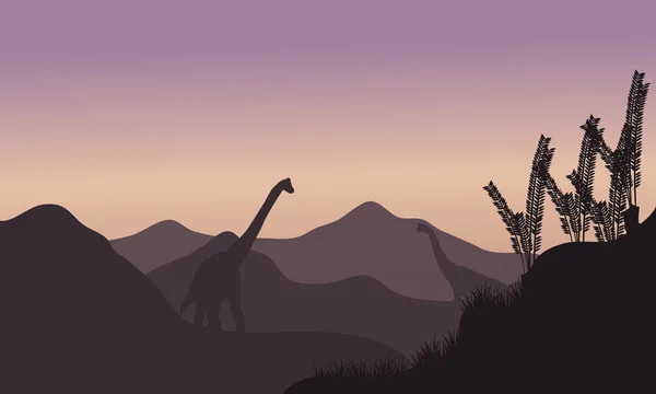 Silhouette of two brachiosaurus in fields — Stock Vector
