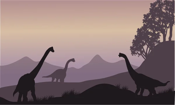 Silhouet van vele brachiosaurus — Stockvector