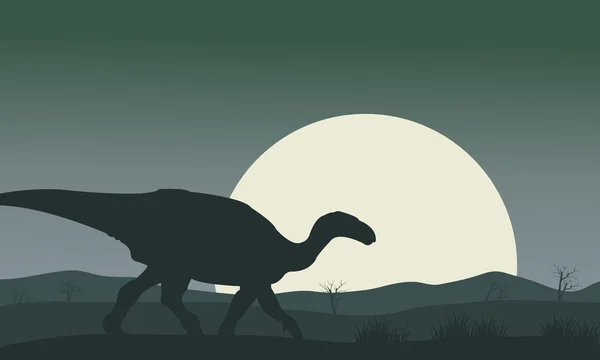 Silhouette d'Iguanodon avec lune — Image vectorielle