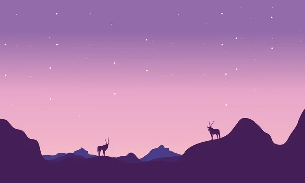 Bei Nacht Antilope in Hügellandschaft Silhouette — Stockvektor
