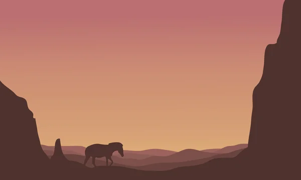 Silhouette of zebra in hills scenery — Stock Vector