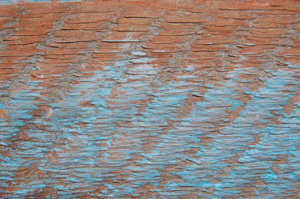 Antiga parede de estuque de terracota pintada com traços de tinta azul . — Fotografia de Stock