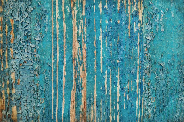 Tinta rachada em uma parede de madeira . — Fotografia de Stock