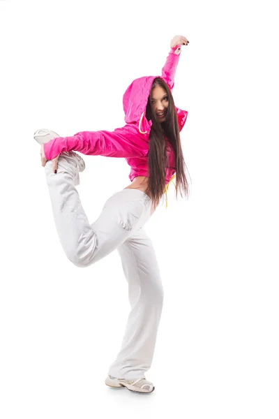 Joven chica moderna y flexible de baile hip-hop de pie sobre una pierna . — Foto de Stock