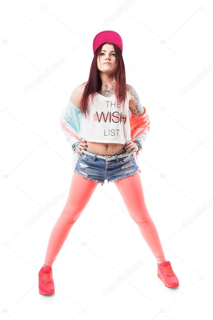 Young hip-hop swag girl in pink tight leggings, crop top and in