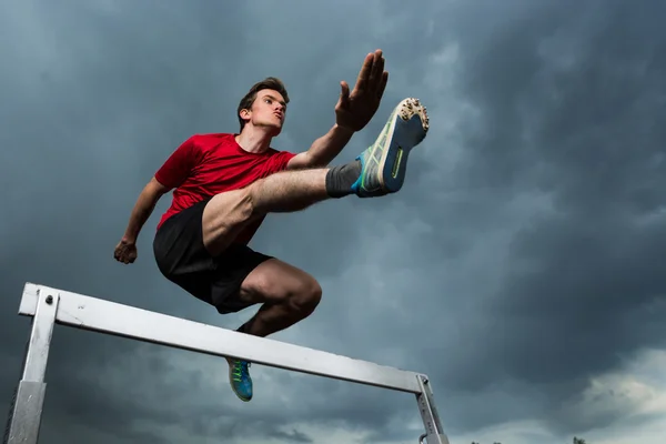 Hurdling in track and field — Stock Photo, Image