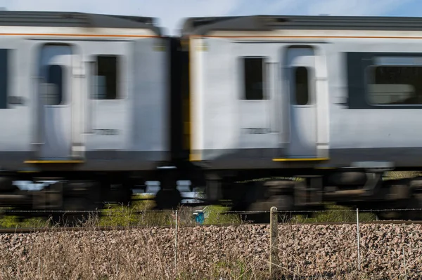 Driving a train in England, a blurry train