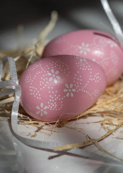 Two Easter pink eggs, beautiful background with shadows