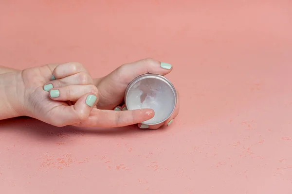 Female Hands Holding White Cosmetic Bottle Pink Background — Stock Photo, Image