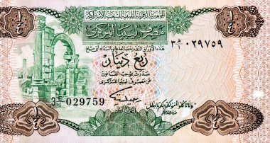 Soldaki harabeler. Libya 'dan Çeyrek Dinar 1984 Banknotları Portresi 