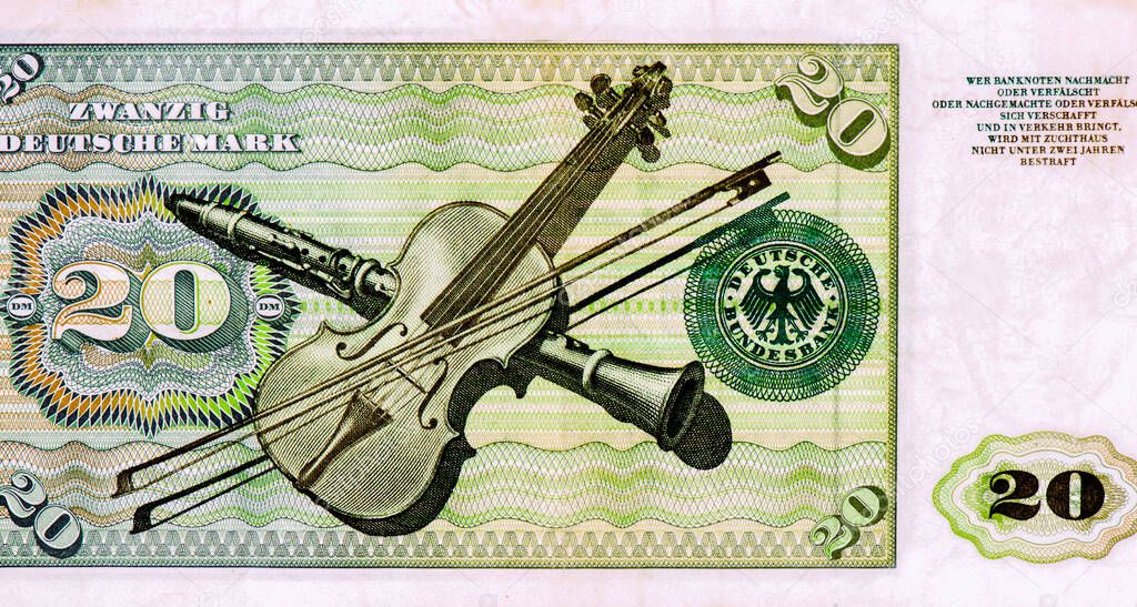Violin, bow and clarinet. Deutsche Bundesbank seal. Portrait from Germany 20 Deutsche Mark 1960 Banknotes.
