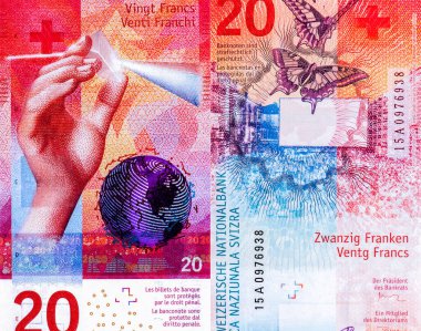 Işığın çeşitli renklere dağılması için bir ışık demetine prizma tutan çocuksu bir sağ el. Globe, İsviçre 'den Portre 20 Frank 2016 Hibrit Polimer Banknotlar.