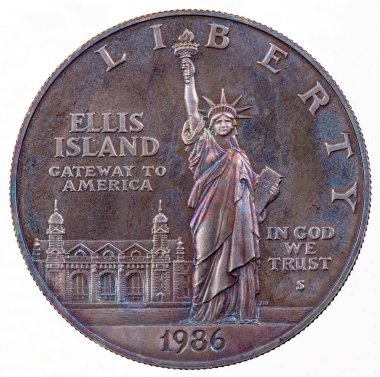The statue of Libertas, a robed Roman liberty goddess. She holds a torch above her head with her right hand, and in her left hand carries a tabula ansata inscribed. Portrait from United States Coin 1 Dollar 1986. clipart